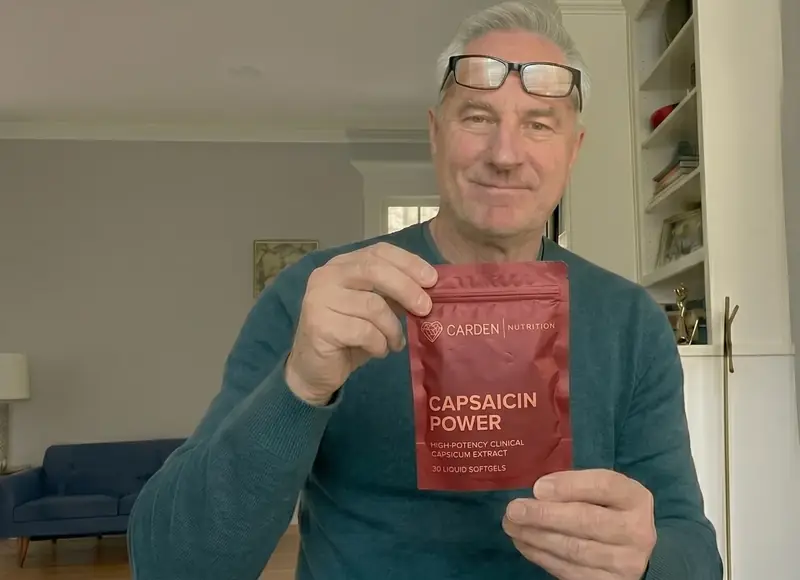 Man holding pack of Carden Capsaicin Power